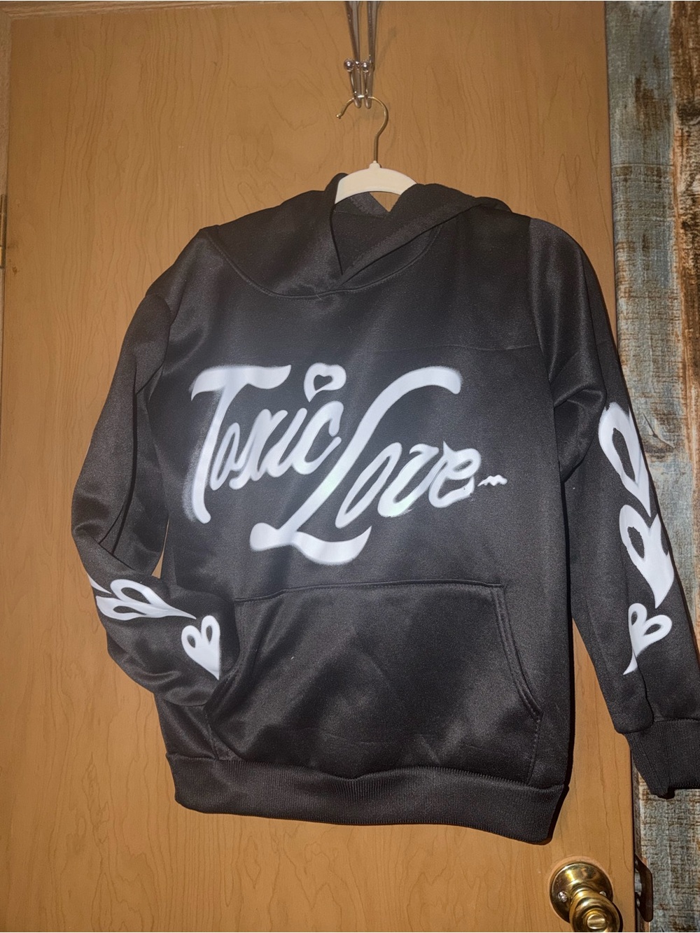 Black Hoodie with White 'Toxic Love' Script
